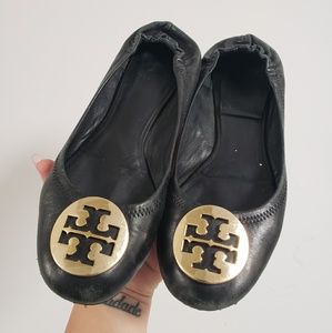 Tory Burch black flats with gold emblem